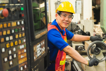 Male industrial workers are willing to perform duties within the industrial factory.