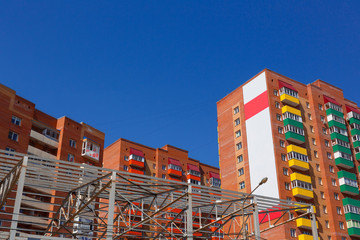 Residential buildings on a background of blue sky