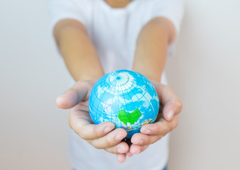 The global world  in children's hands. Concept for environment, Education concept