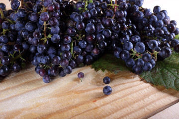 Black wine grape on table