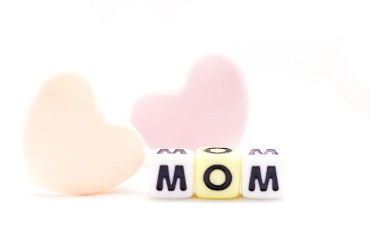 Mom letter blocks with pink heart. white background
