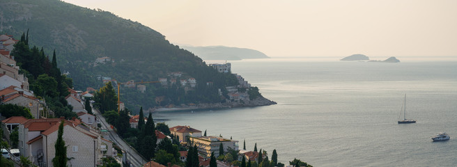 Early morning in the city of Dubrovnik, the city hides behind the mountain from the hot sun, panorama