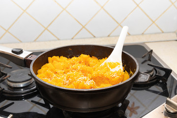 Pumpkin porridge with sesame seeds. View of pumpkin porridge in a pan.