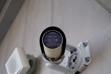 Surveillance camera installed on the wall