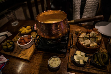 Delicious fondue on wooden table