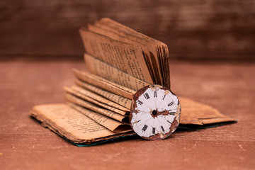 A book over a hundred years old and a watch from 1850