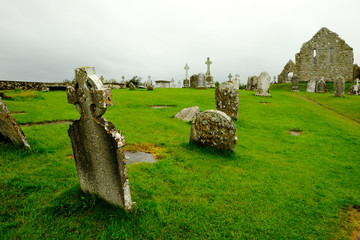 The cemetery in the medieval monastery of Clonmacnoise, Ireland, during a rainy summer day.