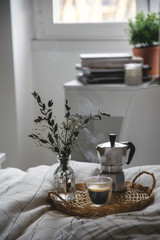 Working studying from home, hot coffee in bed