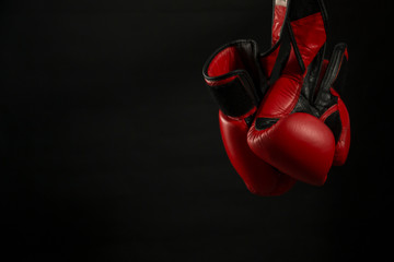 Boxing gloves with black background.