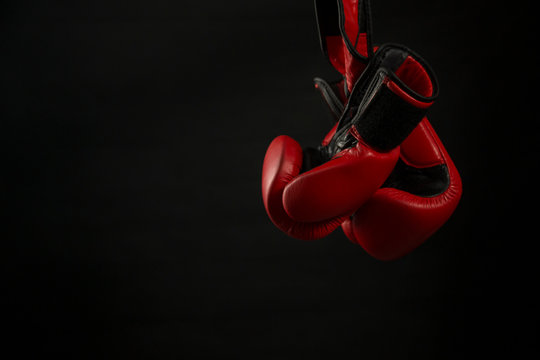 Boxing gloves with black background.