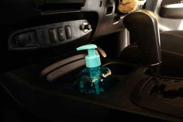 Alcohol gel 70% bottles in car for cleaning hands, Corona virus prevention in car.