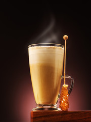 Cup coffee cappuccino or latte with caramel candy