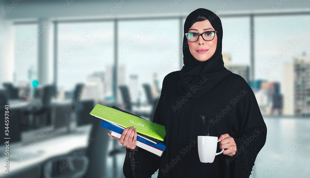 Wall mural Office Woman - Arab girl on Abaya Hijab black dress in Middle East. Beautiful Arabic Emirati lady at inside a business boardroom.