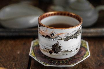 Ceramic glazed cup for a traditional tea ceremony. Hand painted cup. Chinese pottery.