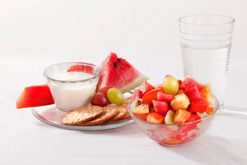 Portion of healthy and balanced food on white background, fruits and vegetables.