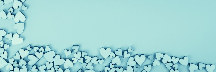 Saint Valentine background heart bottom and left and free space for lettering. Color blue.