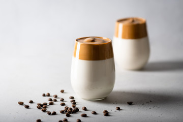 coffee dalgona in a glass on a light background, fashion korean trend. 