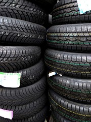 Obraz premium piles of different standard car tires - changing tires