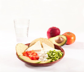 Portion of healthy and balanced food on white background, fruits and vegetables.