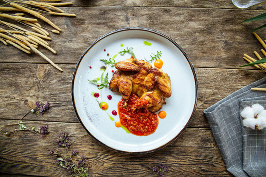 Gourmet roasted tobacco quail red pepper sauce