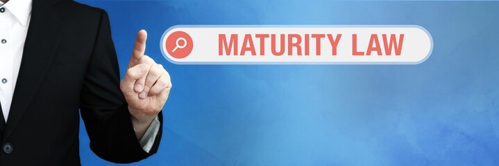 Maturity Law. Lawyer in suit points with his finger to a search box. The term Maturity Law is in...