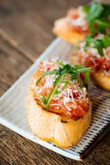 Italian bruschetta tomatoes parmesan arugula