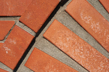 A wall with figured red brick masonry