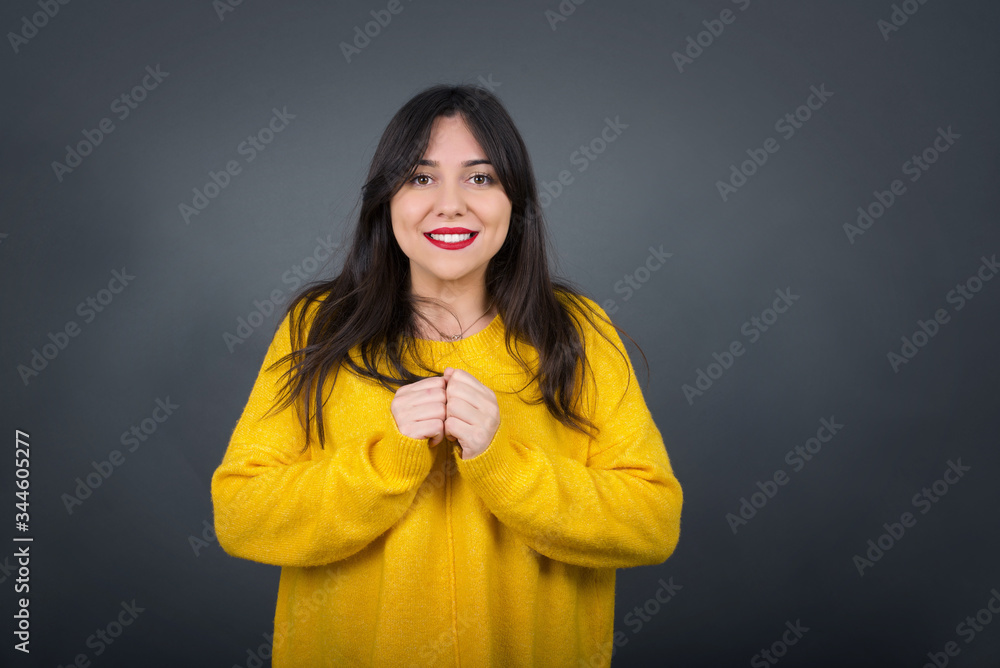 Wall mural wow. beautiful female half-length front portrait isolated on gray studio background. young emotional