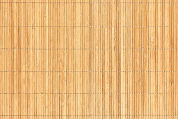 Closeup wooden background of beige bamboo sticks.