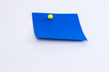 A blue sticker attached with a yellow button ready for your message. Isolated on a white background.