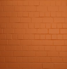 Orange painted smooth brick wall, for texture or background