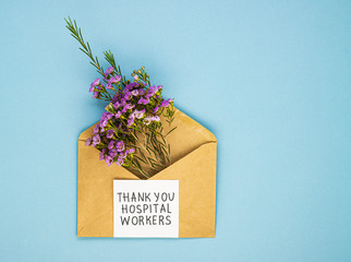 a bouquet of spring wildflowers in an envelope and the inscription thank you to the Jerusalem workers