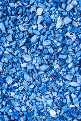 Blue colored texture of gravel. The view from the top. Close up.