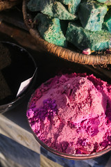 close up of a bowl of colorful powder
