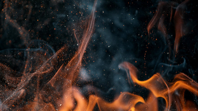 fire flames with sparks on a black background, close-up