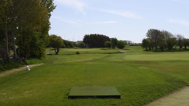 Littlehampton links golf course view of hole 16 the par 3 from the tee box, a  short but challenging hole with water in play.