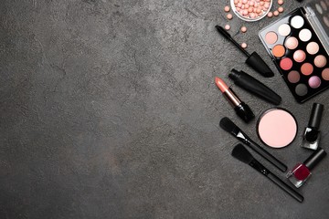 Set of decorative cosmetics on a black background. Place for text