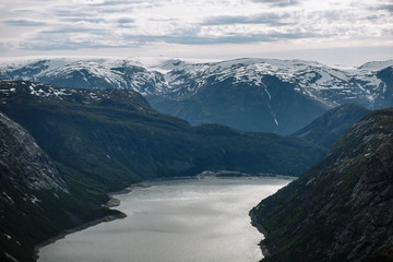 Norwegian landscape with a view of the fjord from a rock fragment Troll's tongue