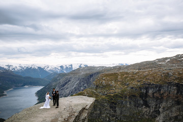 Exit wedding ceremony on a rock fragment in Norway called Troll's tongue