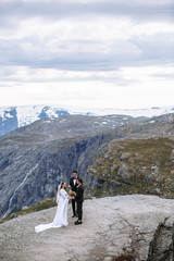 Exit wedding ceremony on a rock fragment in Norway called Troll's tongue