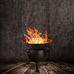 Kettle grill with hot briquettes and fire flames. Freeze motion barbecue concept.