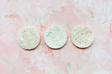 Three round loofah discs. Natural face sponges. Beauty treatment, plastic free and zero waste...