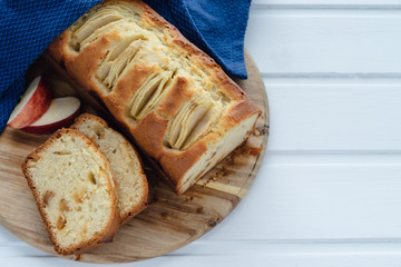 Cut apple cake on a white background. Copy space. Baking concept.