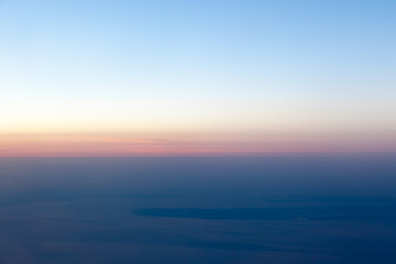 Sunset landscape view of the coast from the plane.