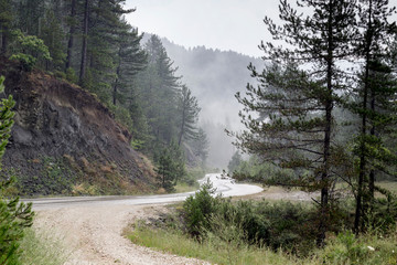 Fototapeta premium Rain on a mountain road (Epirus region, Greece)