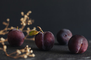 Organic plum on a dark background