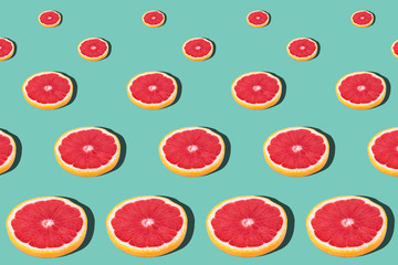 Seamless pattern with juicy kiwi and greapfruit on light blue background
