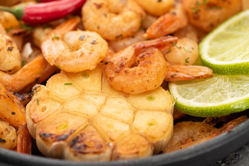 close up view of fried shrimps with corn and lime