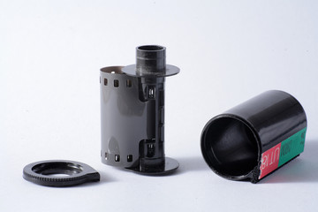 vintage 35mm Leica analogue  film rolls canister 136 color slide bulk loaded stock. Vintage Film's not dead isolated on white background simple minimalistic composition