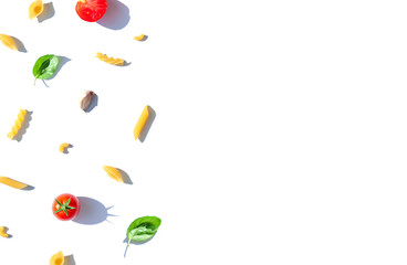 Italian pasta frame concept with tomatoes , fresh basil leaves and garlic. Food top view composition. Copy space